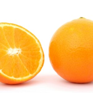 Close-up of a whole orange and a sliced half on white background, highlighting freshness.